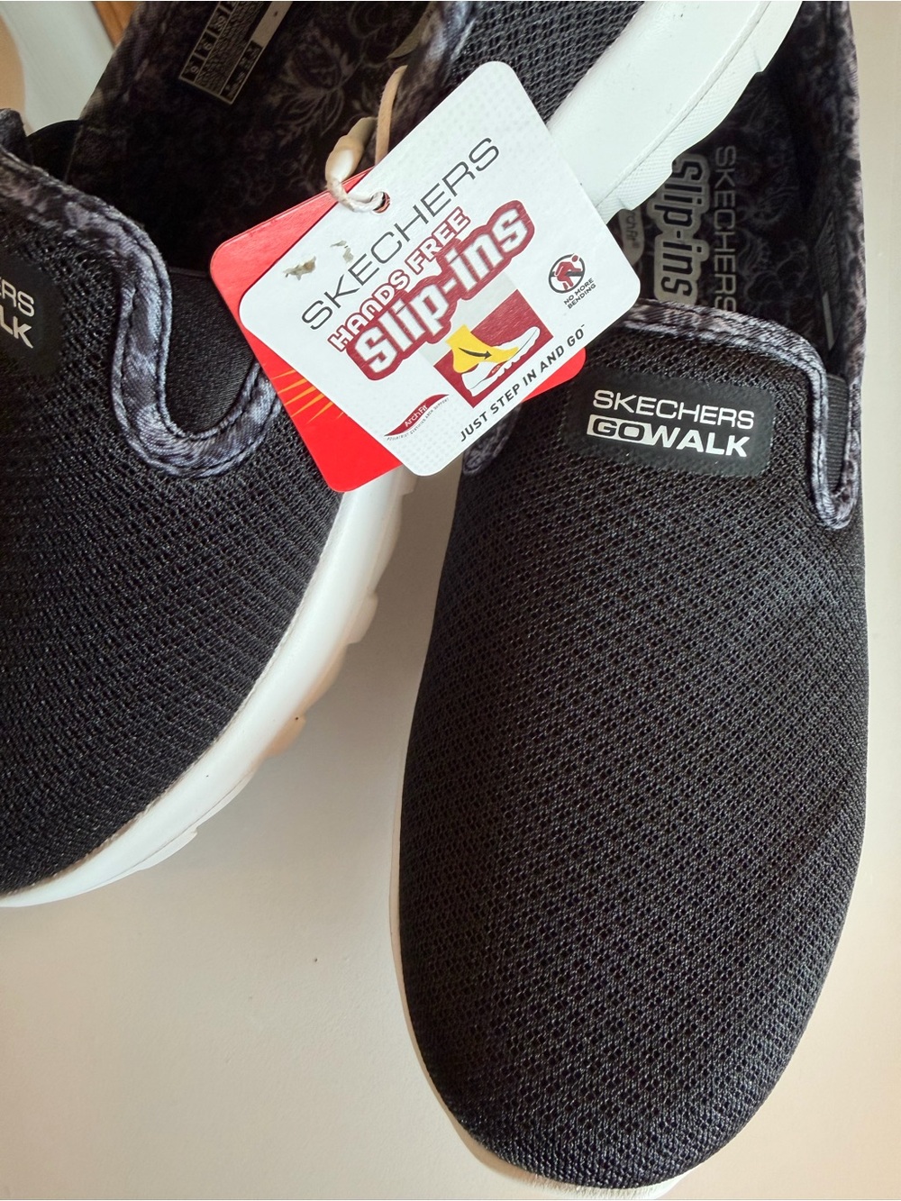 Skechers Black and White GOwalk Slip-On Sneakers